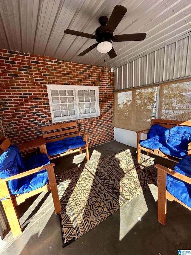 sunroom featuring ceiling fan