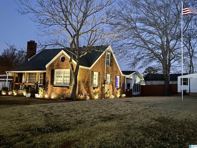 view of side of property featuring a yard