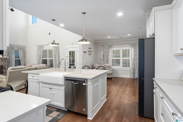 kitchen with white cabinets, decorative light fixtures, stainless steel appliances, an island with sink, and dark hardwood / wood-style floors