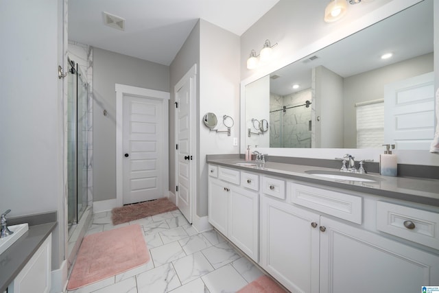 bathroom with walk in shower and vanity