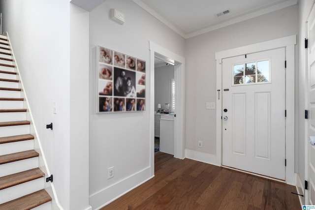 foyer featuring dark wood-type flooring and ornamental molding