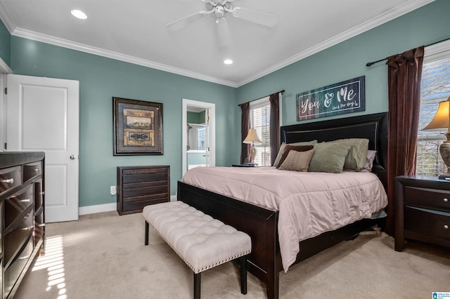 bedroom with crown molding, connected bathroom, light colored carpet, and ceiling fan