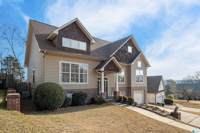 view of front facade featuring a garage and a front lawn