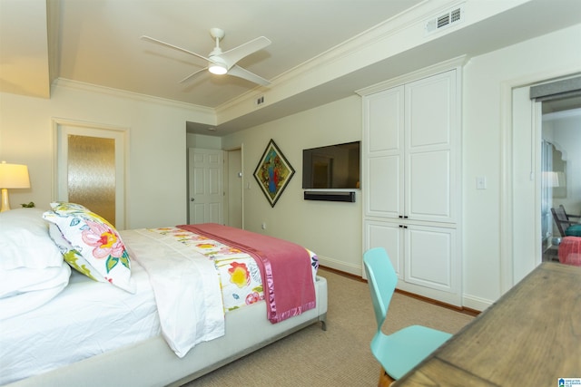 bedroom with a closet, ceiling fan, and crown molding