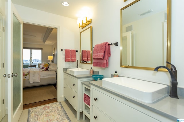 bathroom with vanity and wood-type flooring