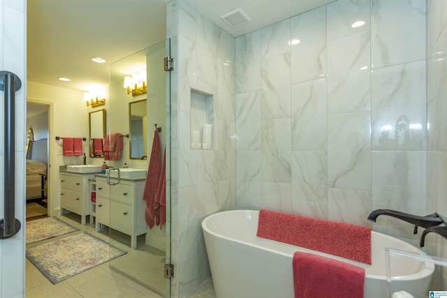 bathroom with separate shower and tub, tile walls, tile patterned floors, and vanity