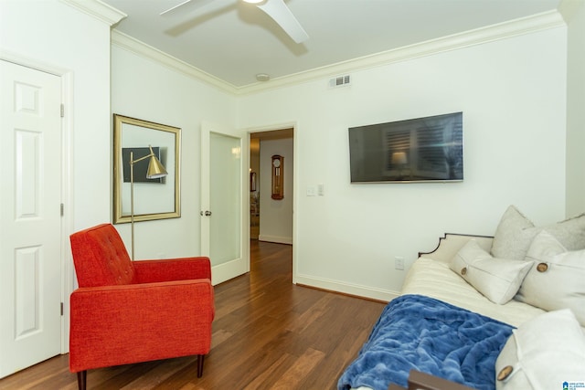 living room featuring dark wood-type flooring, ceiling fan, and ornamental molding