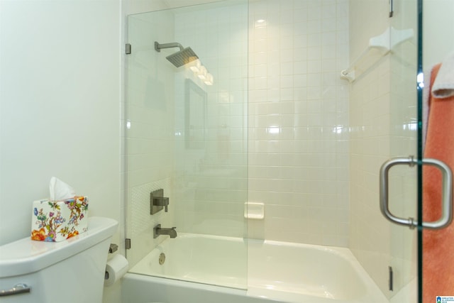 bathroom featuring shower / washtub combination and toilet