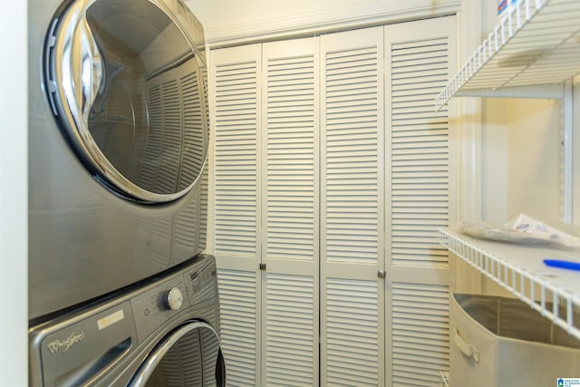 washroom featuring stacked washer and dryer