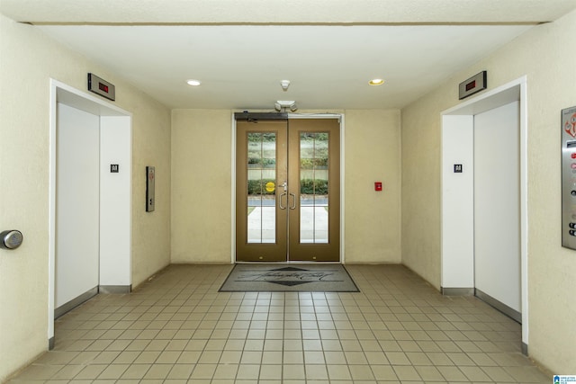 interior space featuring elevator and french doors