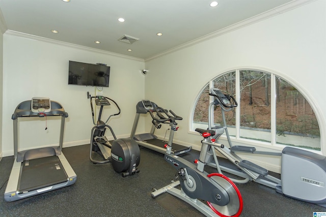 exercise room with ornamental molding