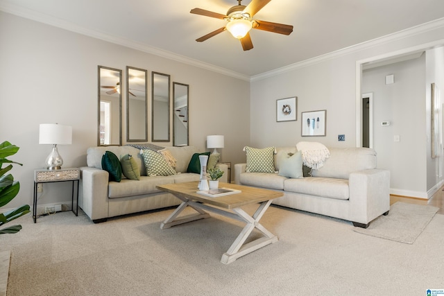 living room with ceiling fan, light colored carpet, and ornamental molding