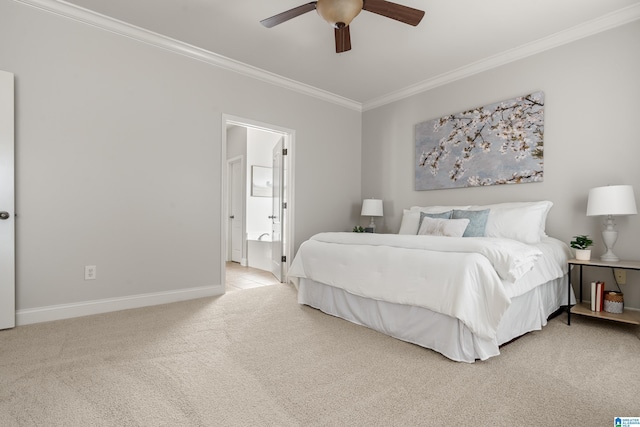 carpeted bedroom featuring ensuite bathroom, ceiling fan, and crown molding