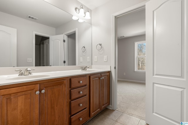 bathroom featuring tile patterned floors and vanity