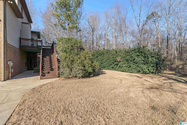 view of yard with a wooden deck