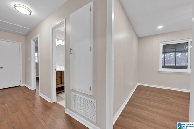 corridor with wood-type flooring