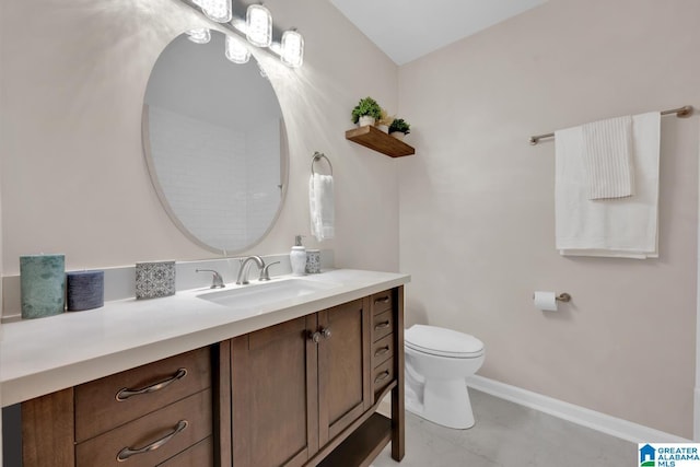 bathroom featuring toilet and vanity