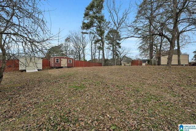 view of yard with a storage unit