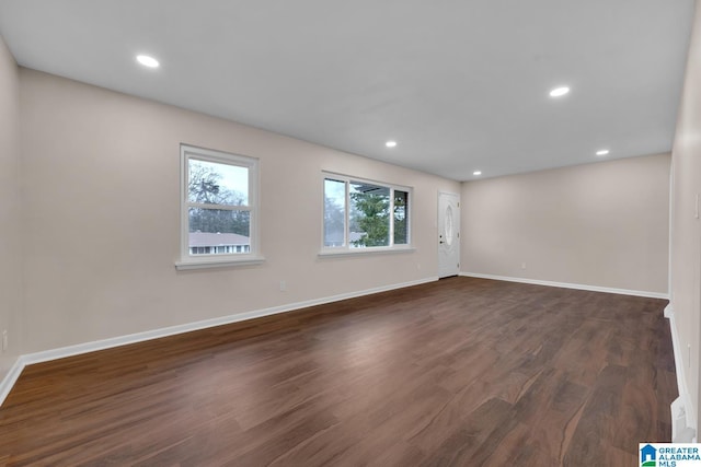 empty room featuring dark hardwood / wood-style floors