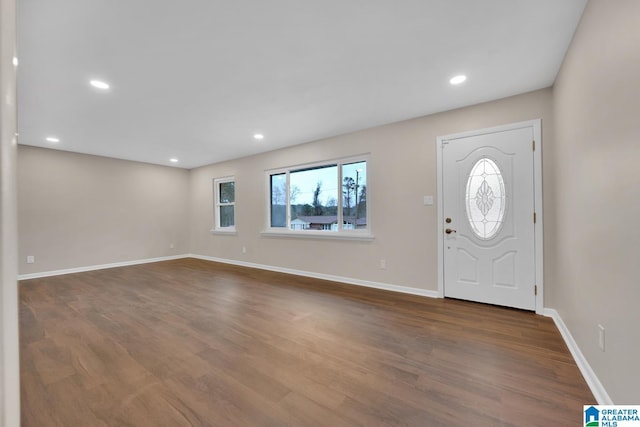 foyer entrance with dark hardwood / wood-style floors