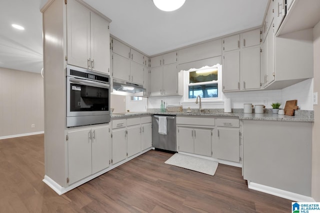 kitchen featuring dark wood-type flooring, sink, white cabinetry, and appliances with stainless steel finishes