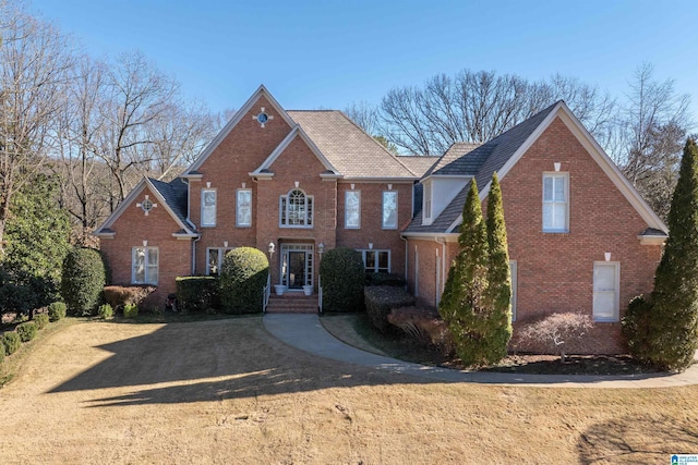 view of property featuring a front lawn