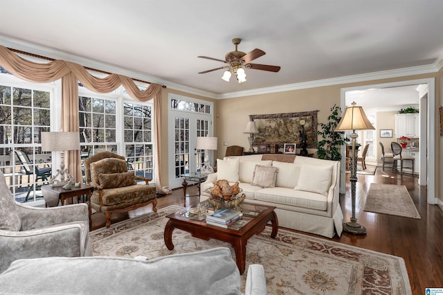 living room with ceiling fan, wood-type flooring, and ornamental molding