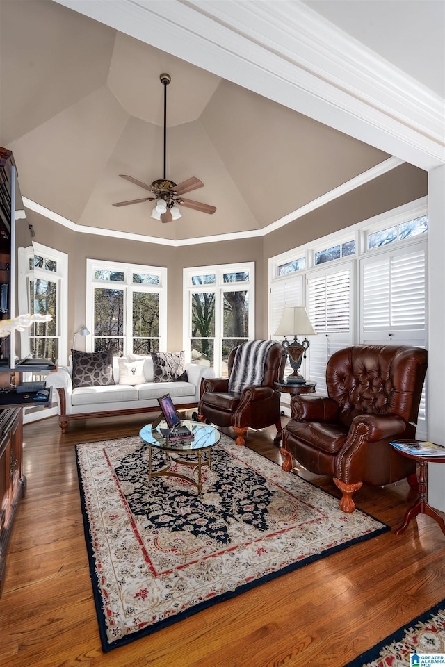 living room with dark hardwood / wood-style floors, high vaulted ceiling, and ceiling fan