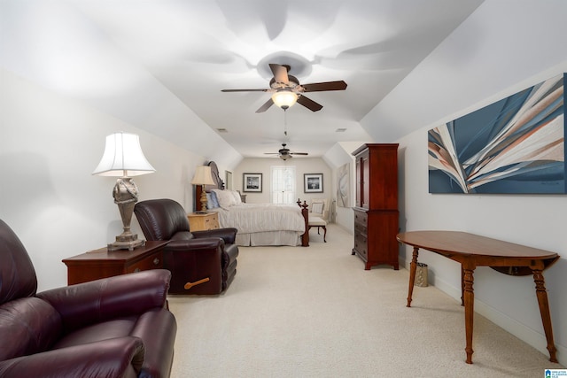 carpeted bedroom featuring ceiling fan and vaulted ceiling