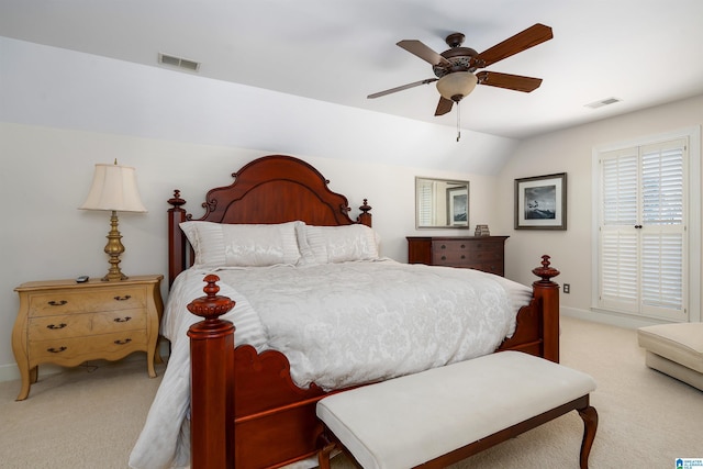 bedroom with ceiling fan, light carpet, and lofted ceiling