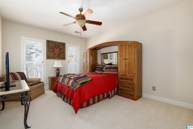 bedroom featuring ceiling fan and light colored carpet