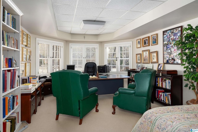 office with light carpet and a drop ceiling