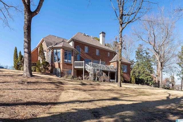 rear view of house with a deck and central AC