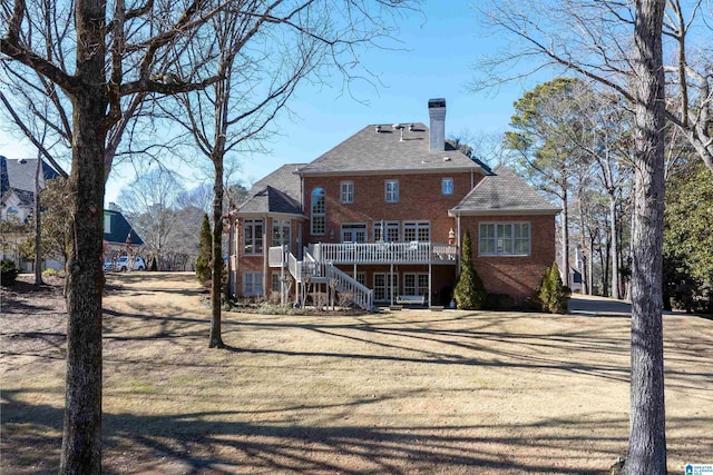 rear view of property with a deck