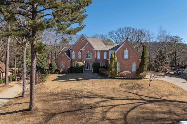 view of property featuring a front lawn