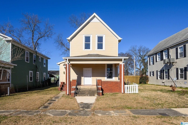 view of front of house featuring a porch and a front yard