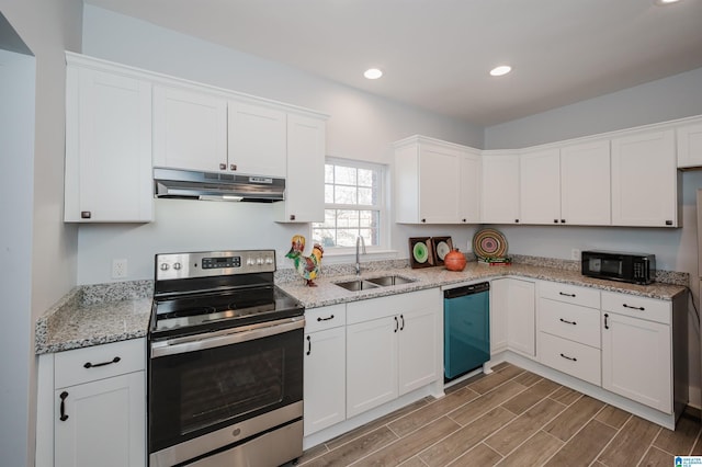 kitchen with sink, black appliances, white cabinetry, and light stone countertops