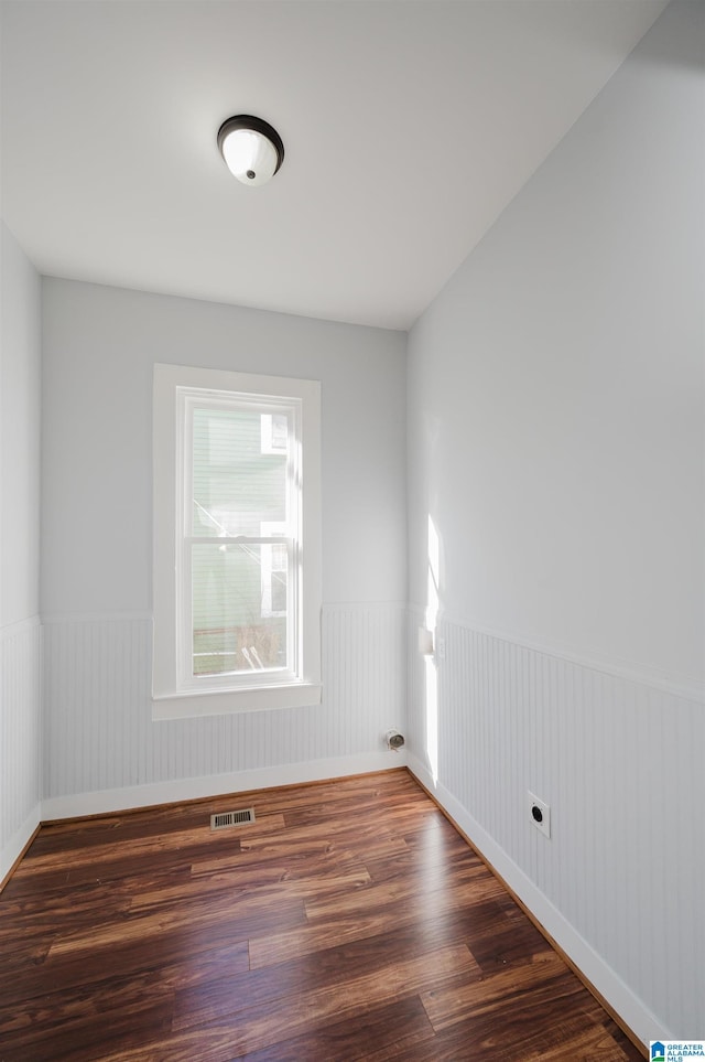 spare room featuring dark hardwood / wood-style flooring