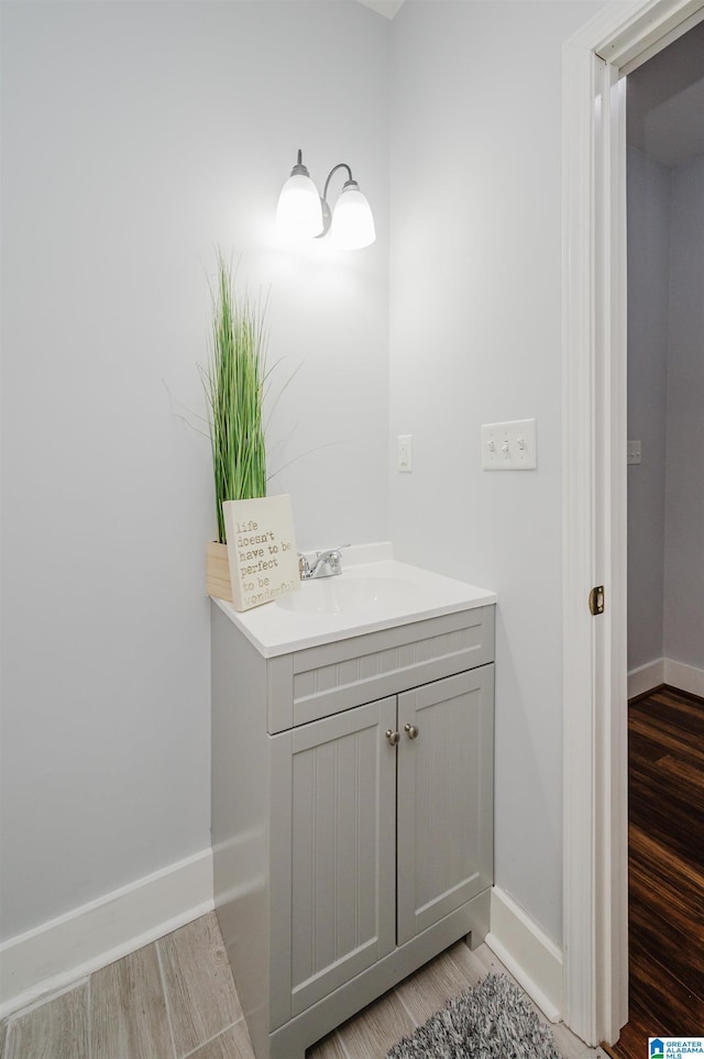 bathroom with vanity and hardwood / wood-style floors