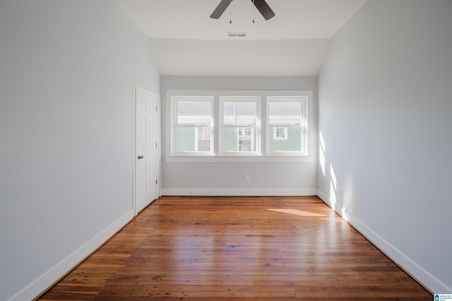 spare room featuring vaulted ceiling, ceiling fan, and hardwood / wood-style flooring