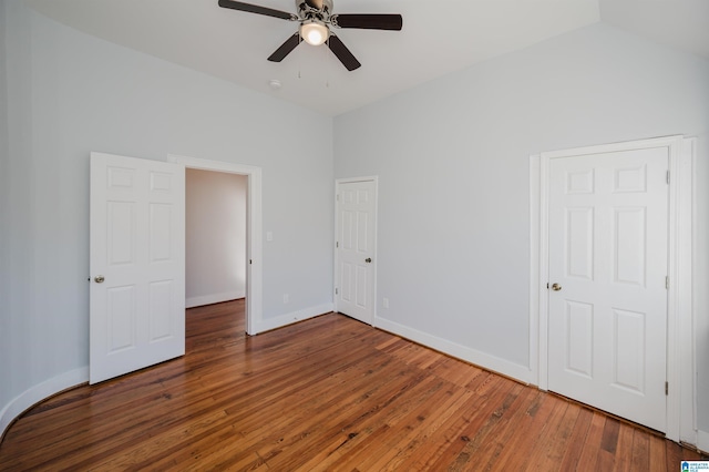 unfurnished bedroom with dark wood-type flooring and ceiling fan