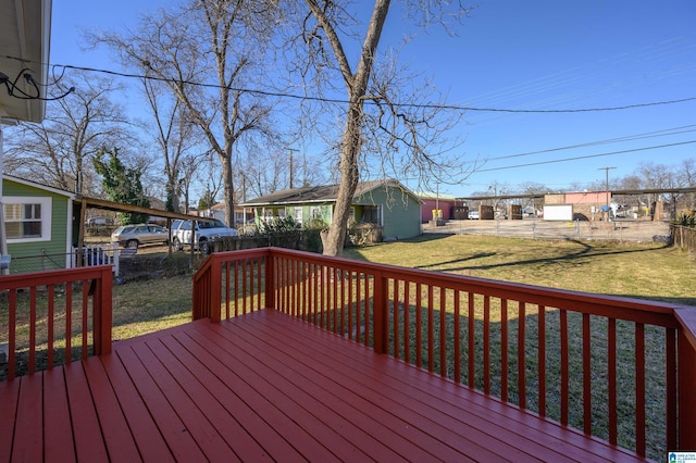 wooden terrace with a yard