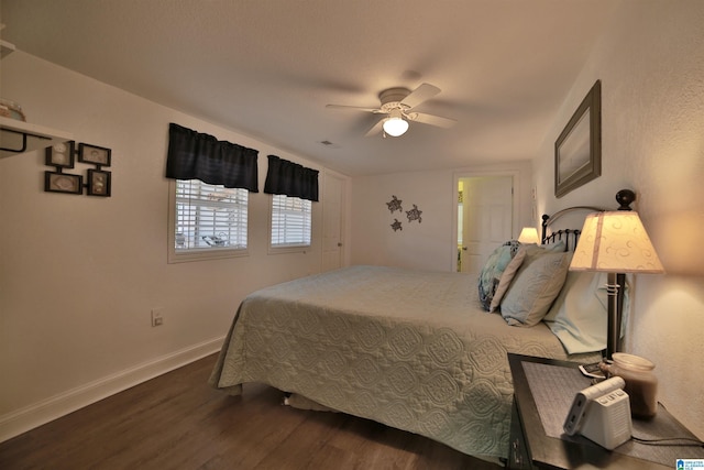 bedroom featuring ceiling fan and dark hardwood / wood-style flooring