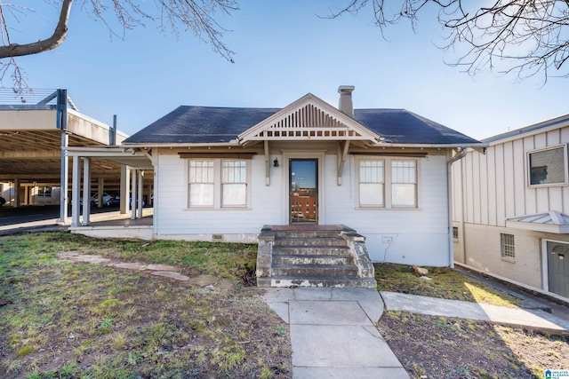 view of front of home with a carport