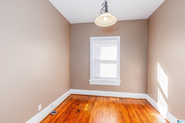 unfurnished room featuring wood-type flooring