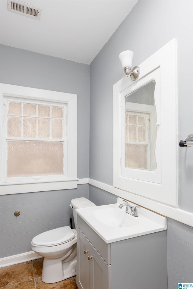 bathroom with vanity and toilet