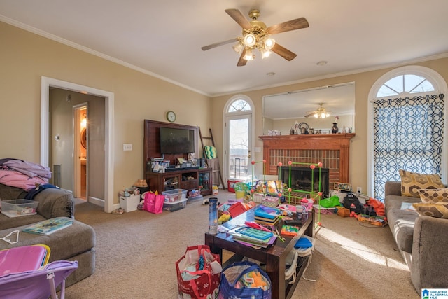 living room featuring ceiling fan, a brick fireplace, ornamental molding, and carpet floors