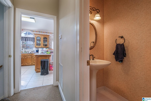 bathroom featuring sink and tile patterned floors