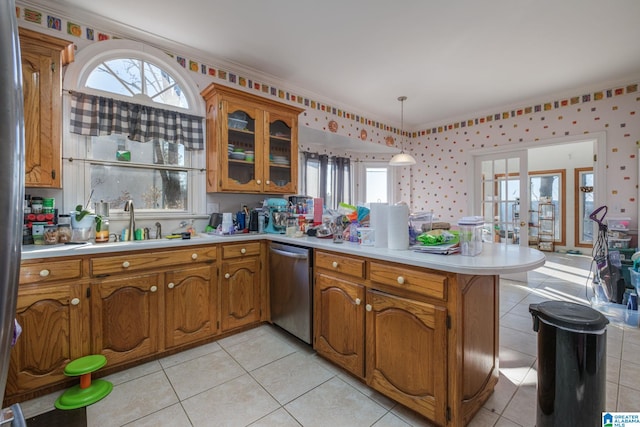 kitchen featuring decorative light fixtures, stainless steel dishwasher, french doors, kitchen peninsula, and light tile patterned floors