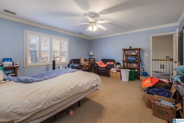 bedroom with ceiling fan, crown molding, and carpet flooring